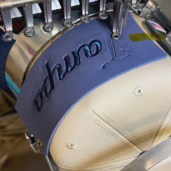 Process of embroidering a puff Tampa hat