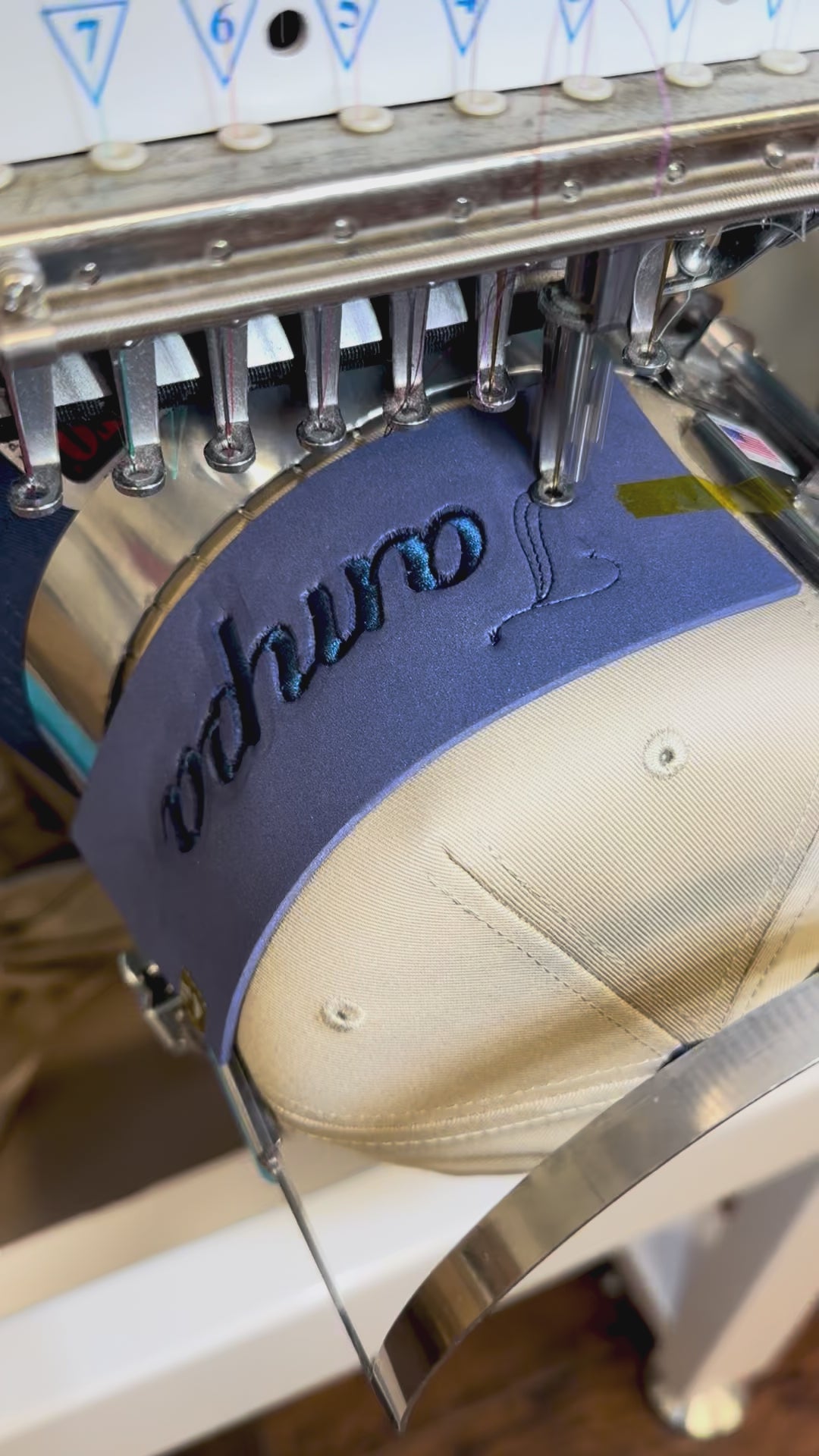 Process of embroidering a puff Tampa hat